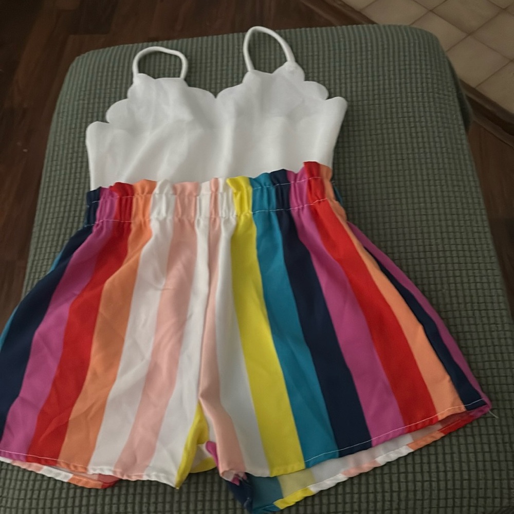 Adorable romper! Little Girls size 9. Colors are bright & beautiful.